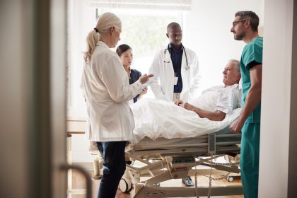 Medical team rounding on long-term care resident