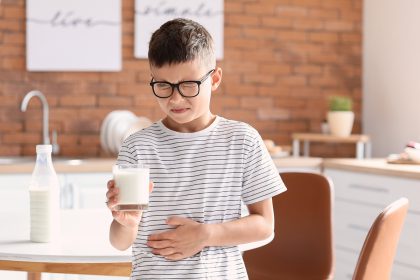 Little boy with dairy allergy in kitchen