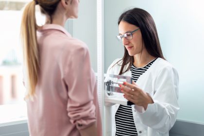 Weighing a patient to calculate BMI