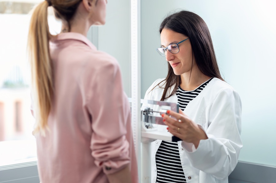 Weighing a patient to calculate BMI