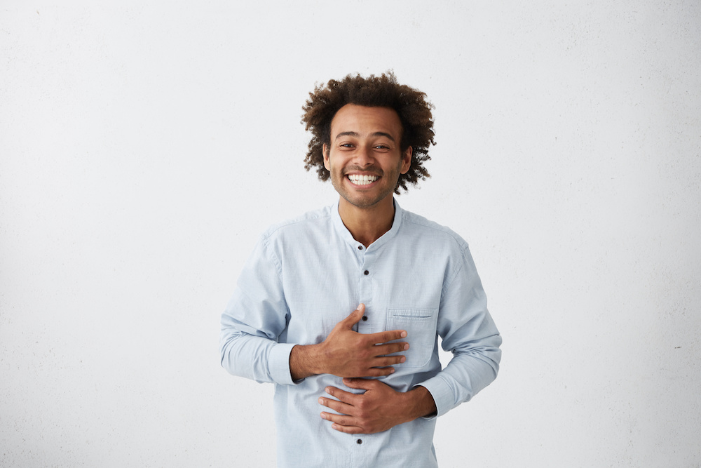 man holding stomach_understanding celiac disease_Dietitians On Demand