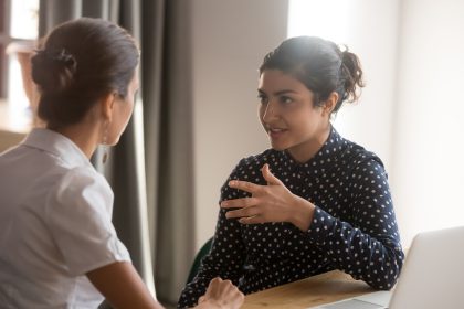 employee speaking with supervisor_Top Reasons Why Employees Quit_Dietitians On Demand