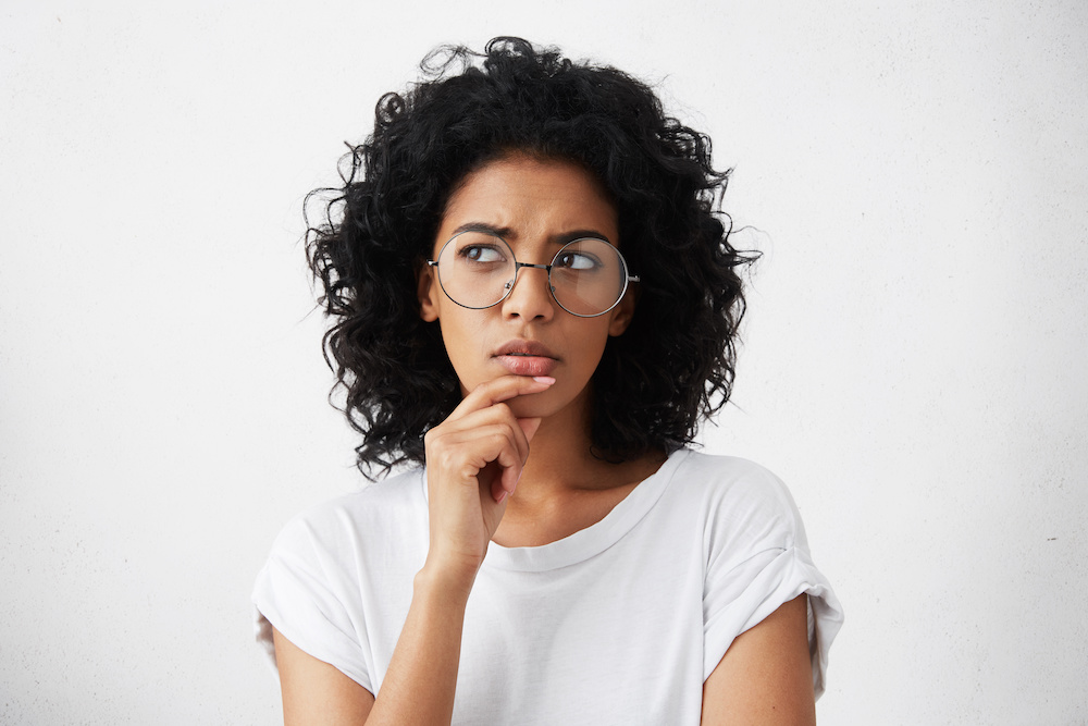 woman with hand on chin questioning_Dietitians On Demand
