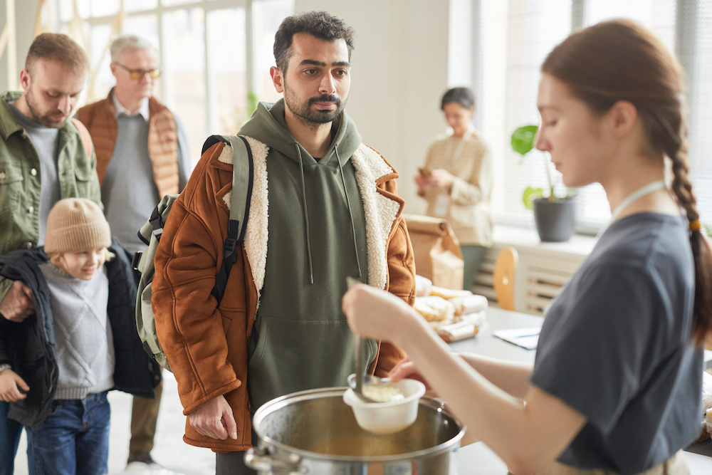 people standing in a food line